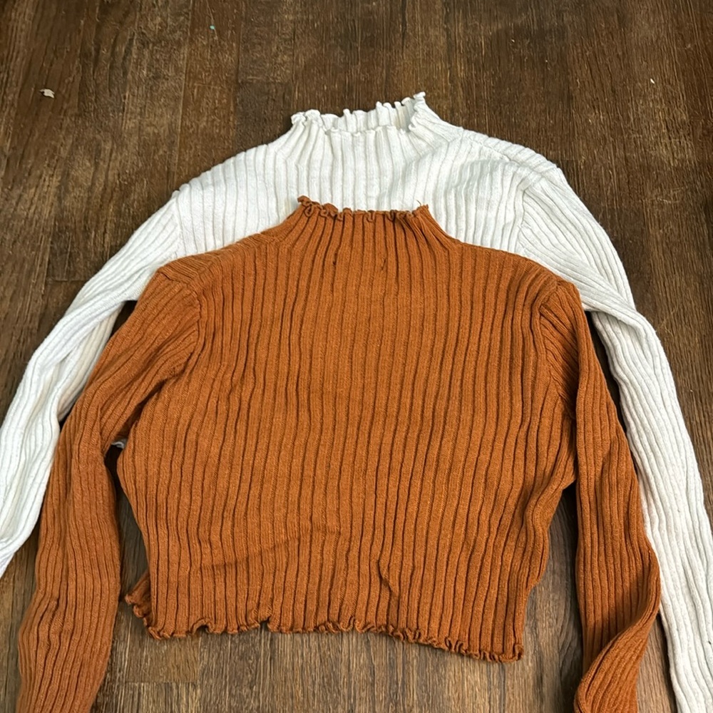 Two turtleneck cropped tops. Riffled